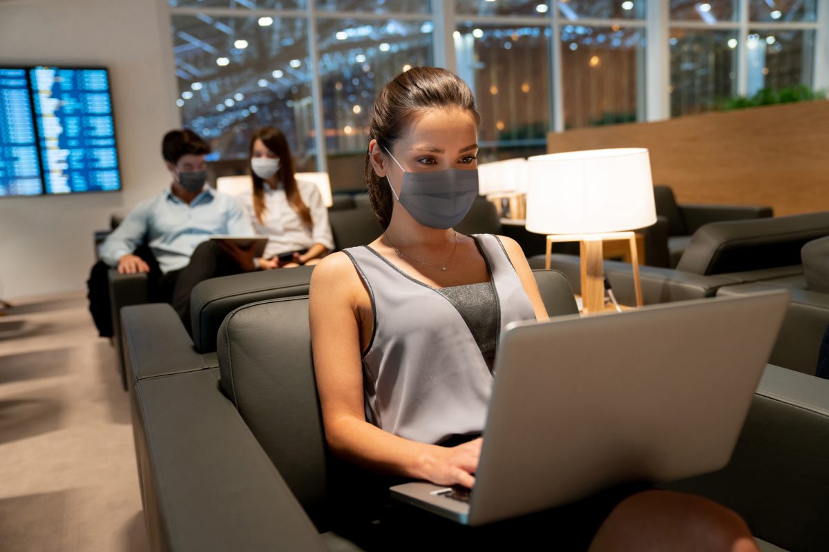 Travelling Business Woman in Airport Lounge