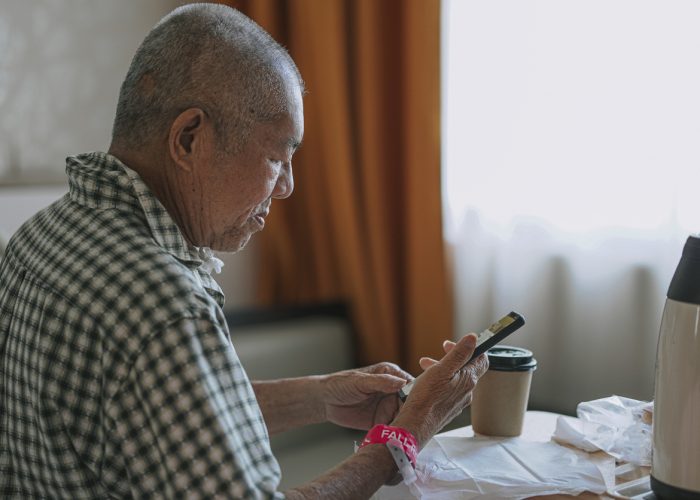 Healthcare patient looking at their phone