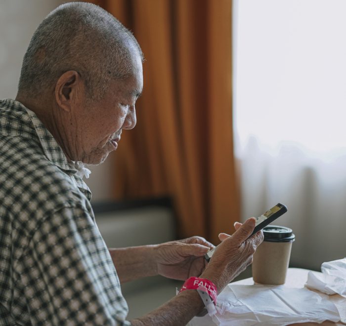 Healthcare patient looking at their phone