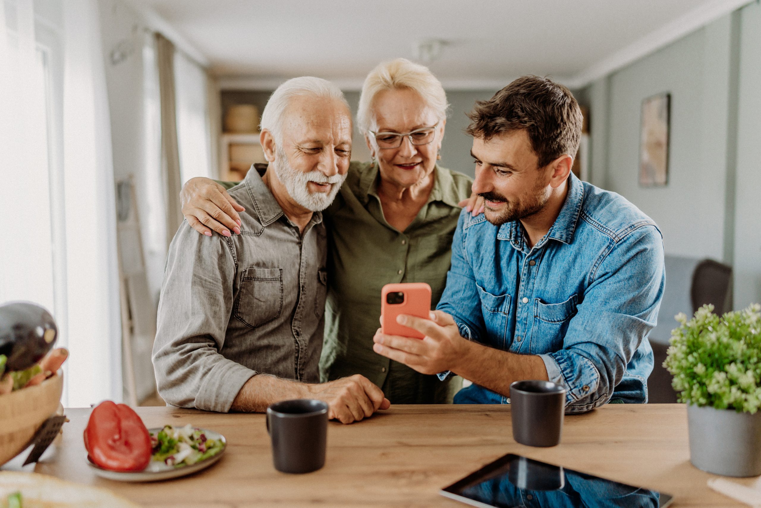 Son visiting his parents and teaching them about new technologies
